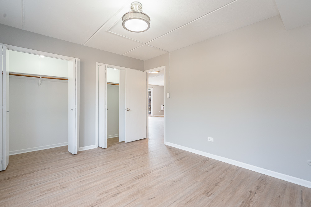 21 South Waiola Avenue, Unit 8 La Grange, IL 60525 - Photo 8 of 18 a view of an empty room with wooden floor