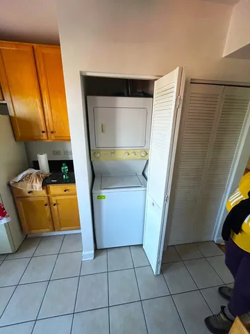a utility room with cabinets