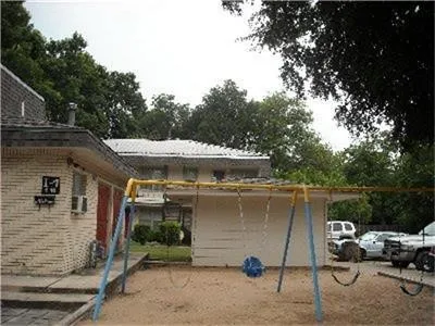 a view of a car park in front of house