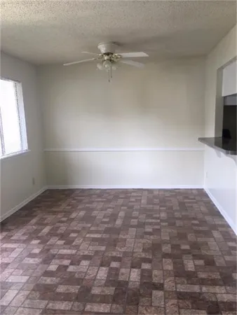 a view of an empty room and a window