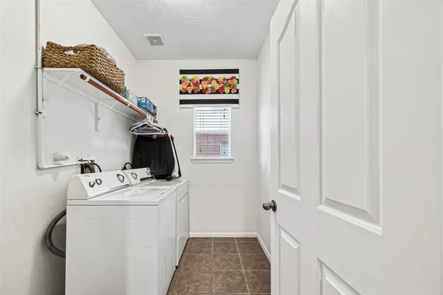 a bedroom with bed and window