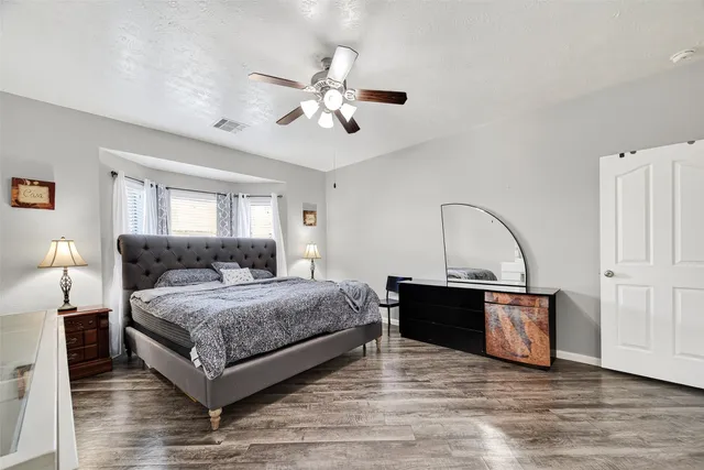 a bathroom with double vanity and a mirror