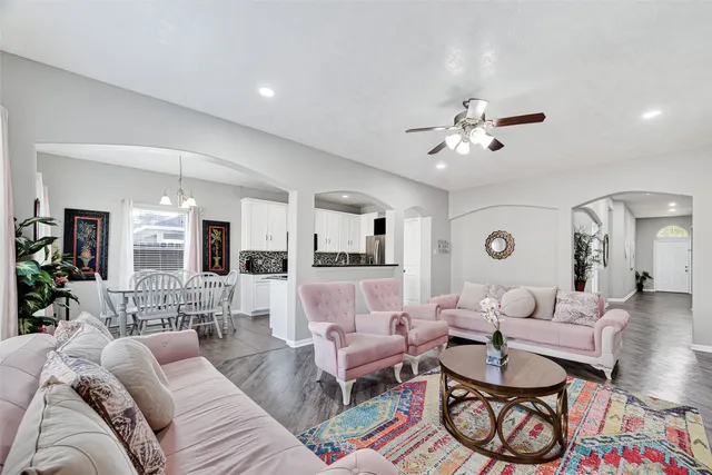 a kitchen with granite countertop a refrigerator and a sink