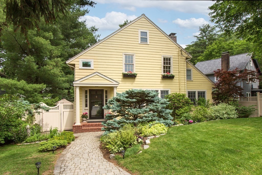 a view of a house with garden and yard