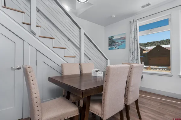a view of a dining room with furniture and window