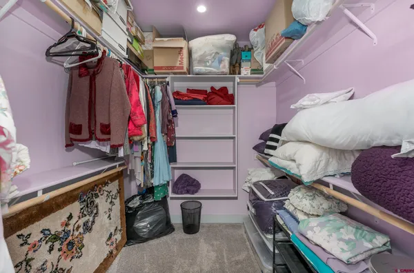 a bed room with a bed and a couch