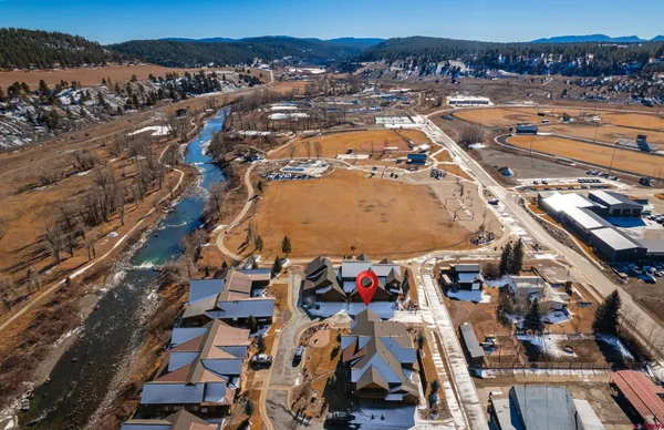 an aerial view of residential houses with outdoor space