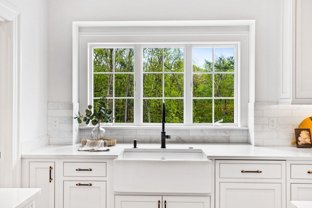 4 Jordan Way Hingham, MA 02043 - Photo 11 of 42 a sink with a window and cabinets