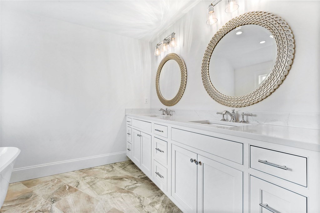 4 Jordan Way Hingham, MA 02043 - Photo 33 of 42 a bathroom with a granite countertop double vanity sink and a mirror