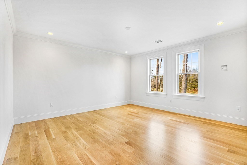 4 Jordan Way Hingham, MA 02043 - Photo 34 of 42 a view of an empty room with wooden floor and a window