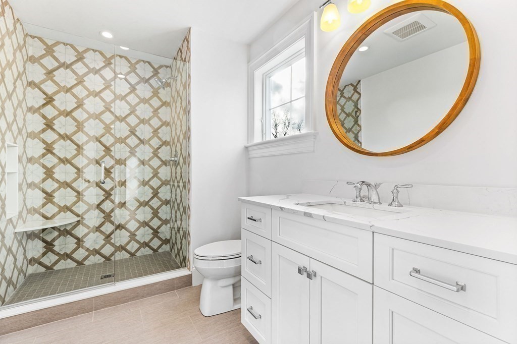 4 Jordan Way Hingham, MA 02043 - Photo 35 of 42 a bathroom with a sink a toilet and a mirror