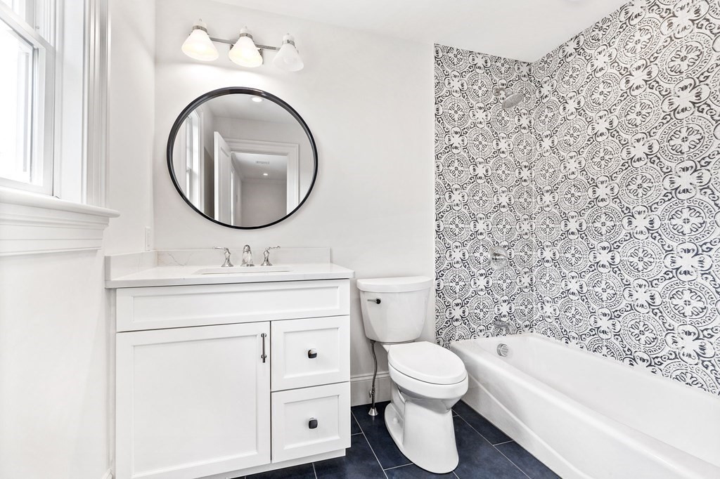 4 Jordan Way Hingham, MA 02043 - Photo 37 of 42 a bathroom with a toilet sink vanity tub and mirror