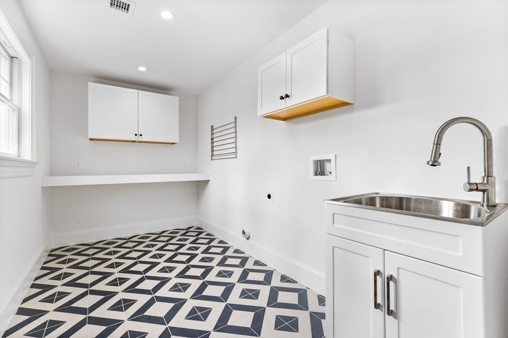 4 Jordan Way Hingham, MA 02043 - Photo 40 of 42 a kitchen with a sink a stove and white cabinets