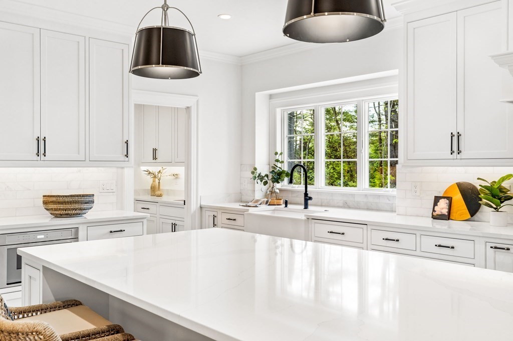 4 Jordan Way Hingham, MA 02043 - Photo 9 of 42 a kitchen with stainless steel appliances a sink a stove and a window