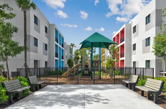 a view of a building with a yard