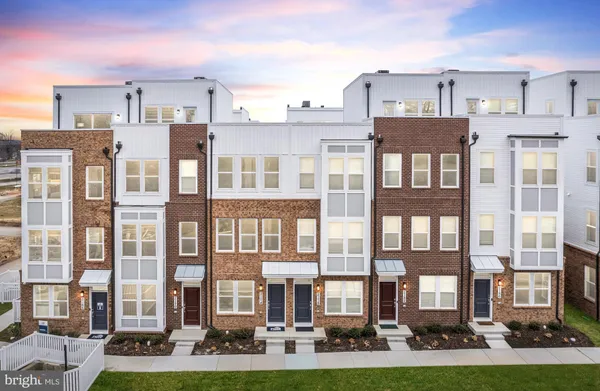 a kitchen with kitchen island a sink and a stove with wooden floor