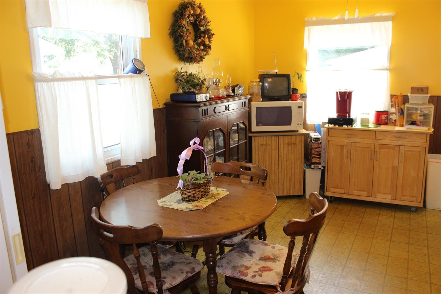 735-1 Juniper Road Valparaiso, IN 46385 - Photo 8 of 10 a view of a dining room with furniture and a window