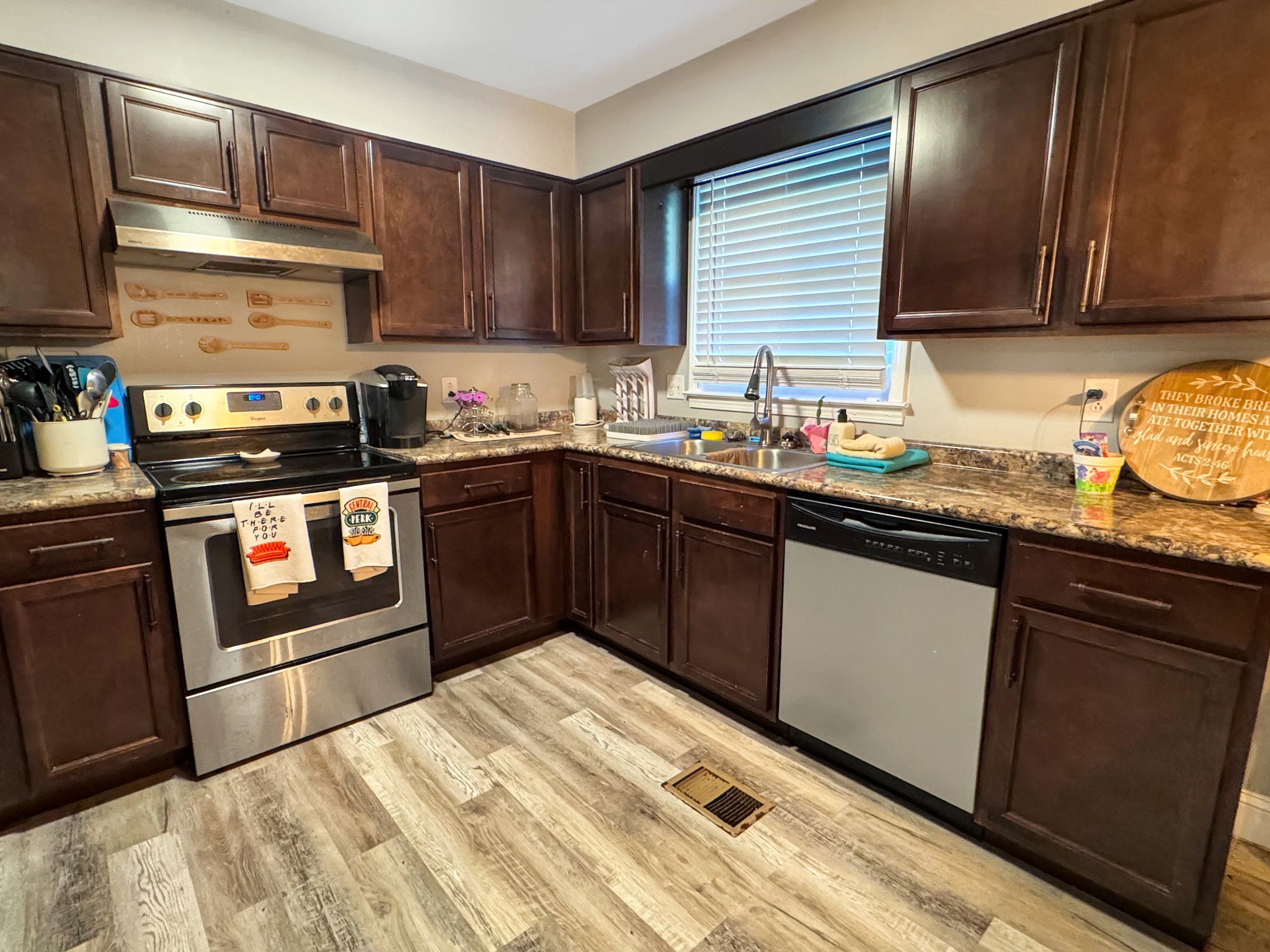 333 Main Street Dover, TN 37058 - Photo 6 of 19 a kitchen with stainless steel appliances granite countertop a sink stove and microwave