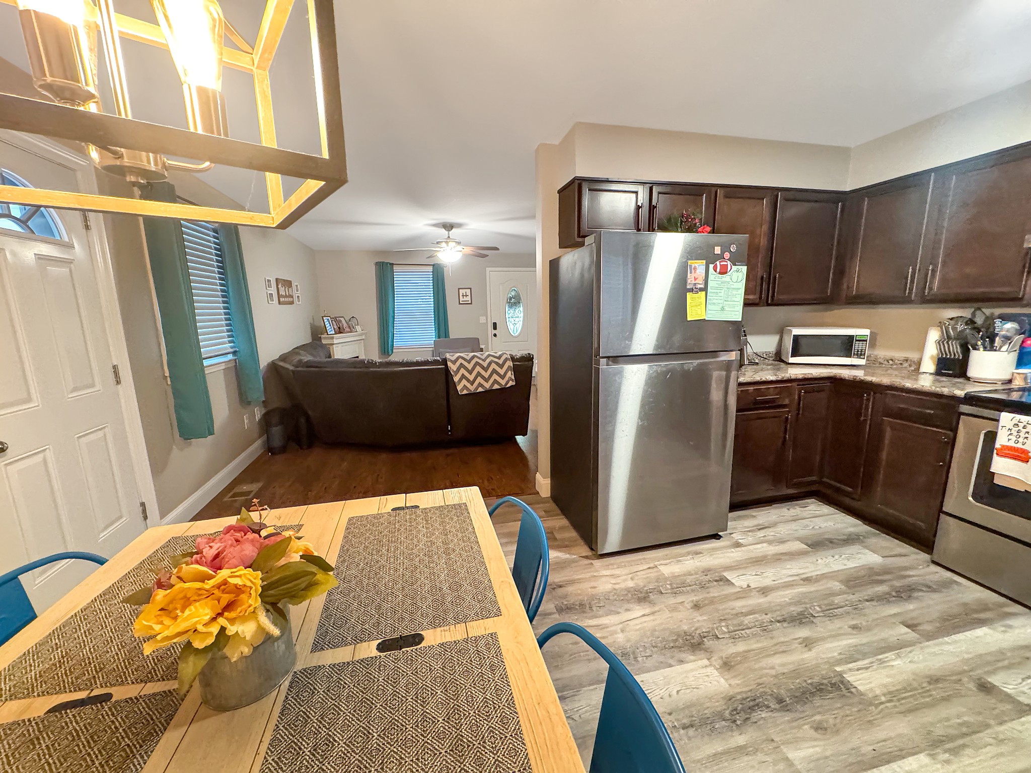 333 Main Street Dover, TN 37058 - Photo 7 of 19 a kitchen with stainless steel appliances granite countertop a refrigerator a sink a stove and wooden cabinets