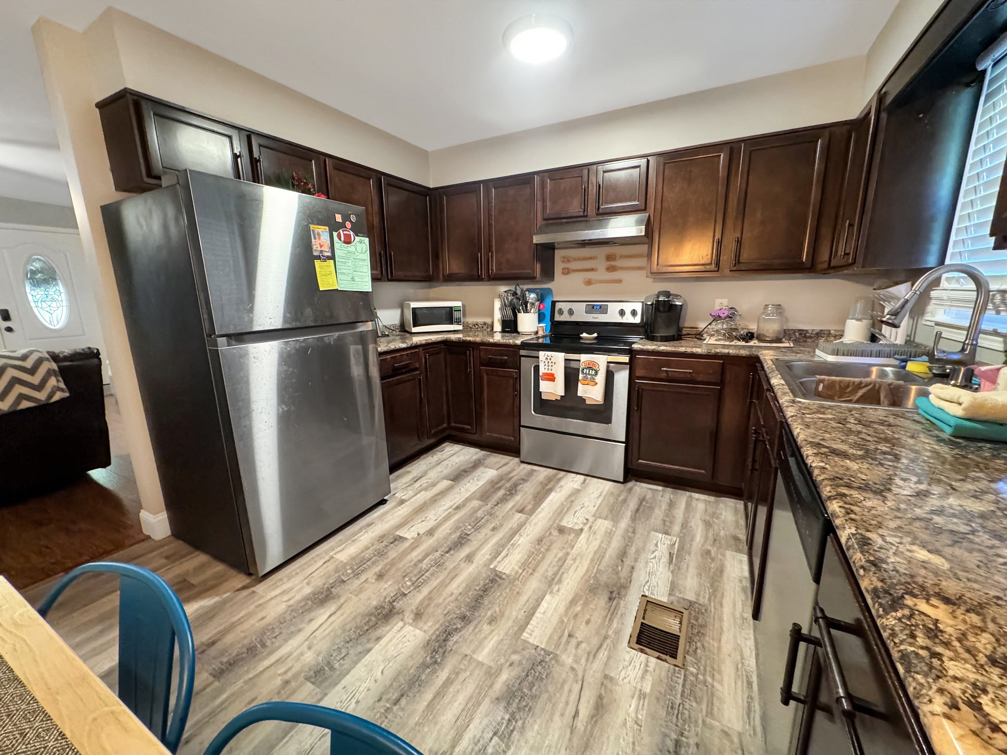 333 Main Street Dover, TN 37058 - Photo 9 of 19 a kitchen with stainless steel appliances granite countertop a refrigerator stove microwave and sink