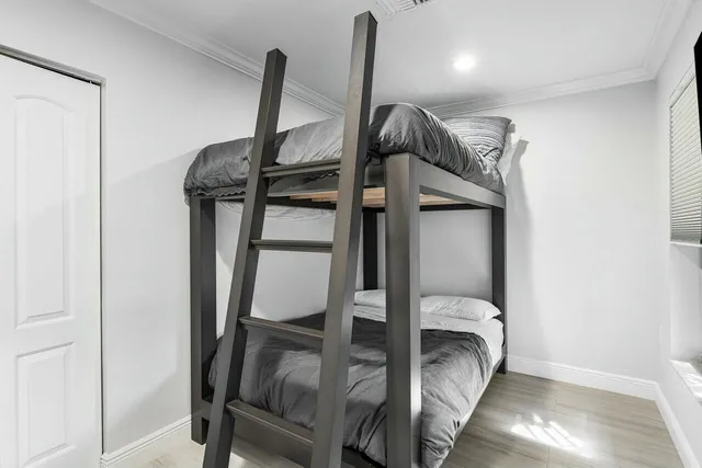 a bedroom with a bed and a table in it