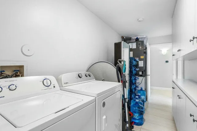 a bedroom with a bed and a cabinets