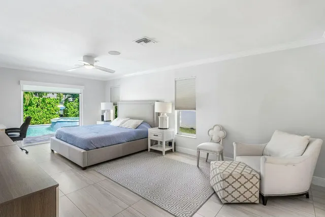 a bedroom with bed and window