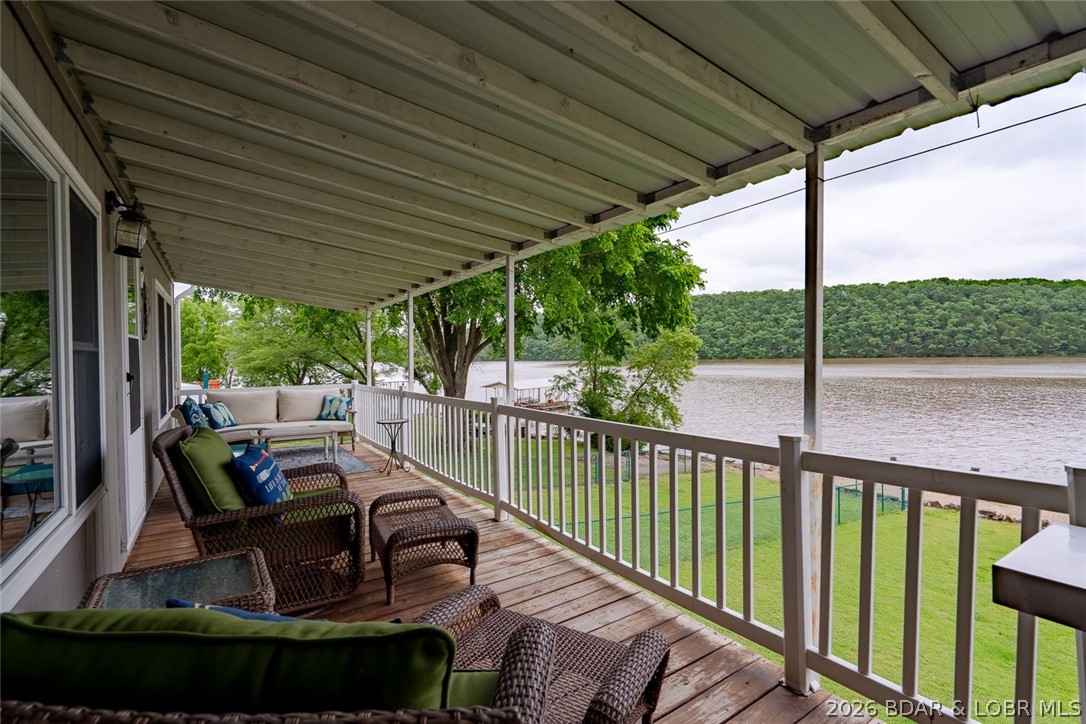 3135 Lick Creek Road Edwards, MO 65326 - Photo 36 of 94 full length deck to enjoy your morning coffee watc