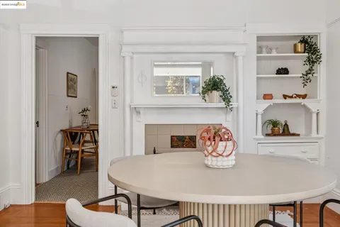 a dining room with furniture and a fireplace