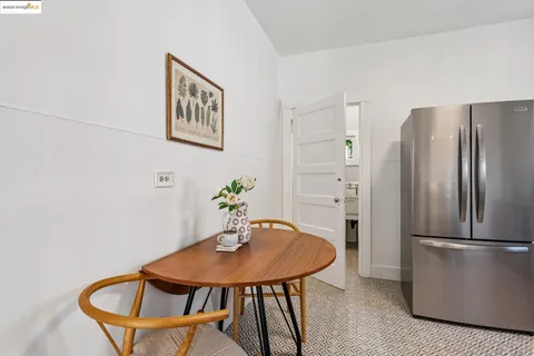 a view of a room with furniture and wooden floor