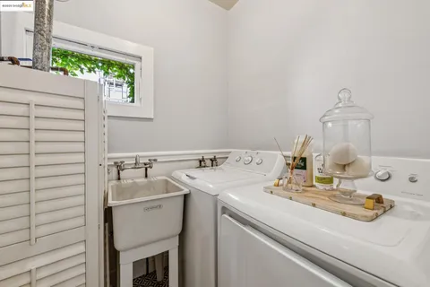 a room with a sink and cabinets