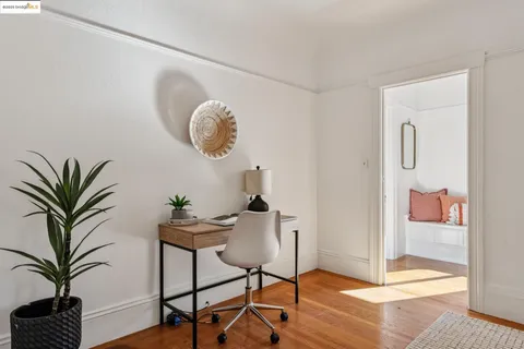 a balcony with wooden floor and stairs