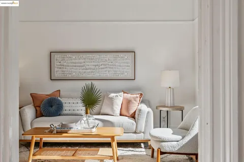 a living room with furniture and a table