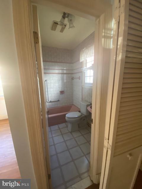 7710 Chatham Road Chevy Chase, MD 20815 - Photo 11 of 40 a bathroom with a glass door shower