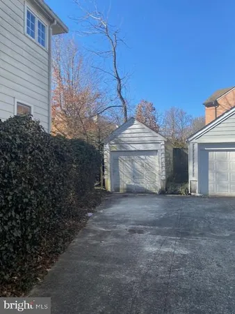 a view of a house with a yard and garage