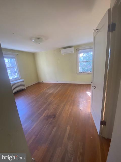 7710 Chatham Road Chevy Chase, MD 20815 - Photo 23 of 40 an empty room with wooden floor and windows