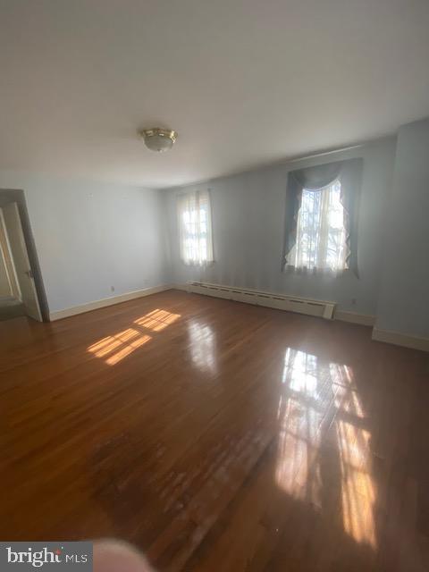 7710 Chatham Road Chevy Chase, MD 20815 - Photo 28 of 40 a view of room with hallway windows and wooden floor