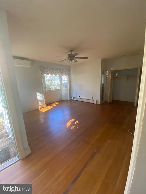 7710 Chatham Road Chevy Chase, MD 20815 - Photo 7 of 40 an empty room with wooden floor and windows