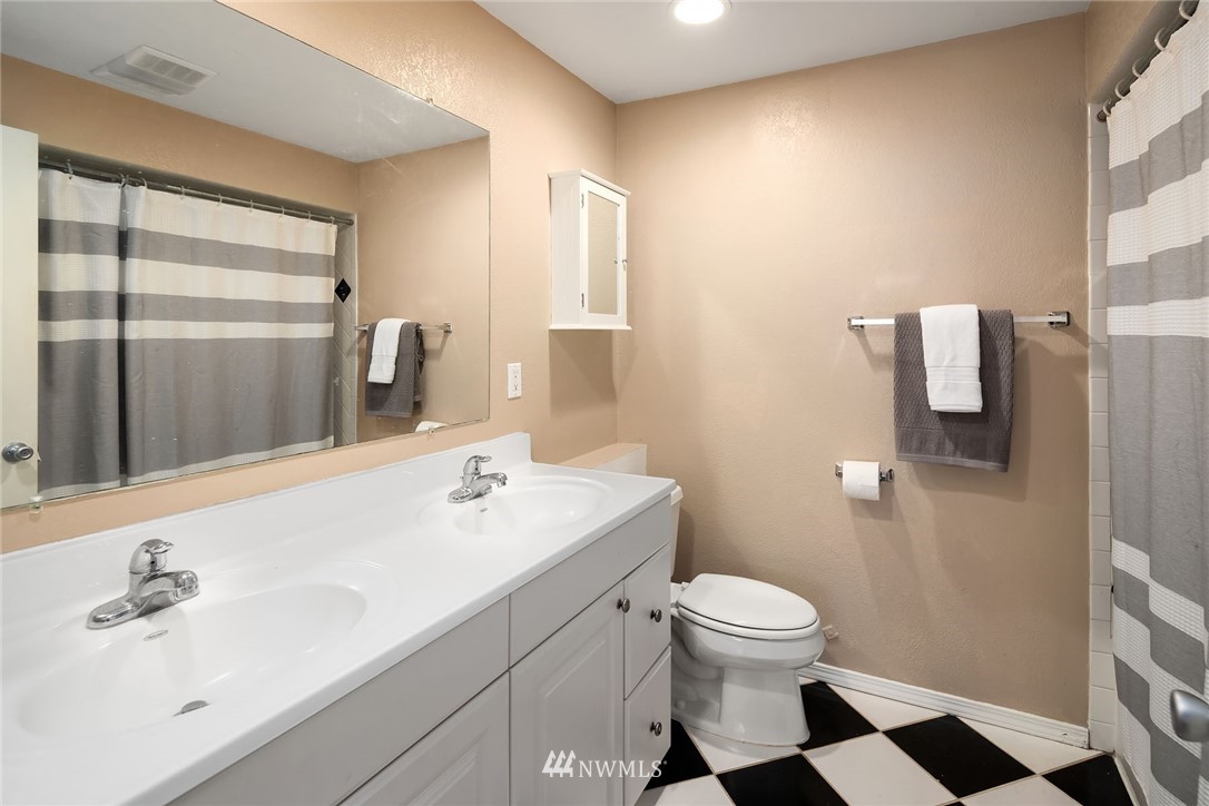 1131 202nd Street Southeast Bothell, WA 98012 - Photo 22 of 24 a bathroom with a sink a toilet and shower