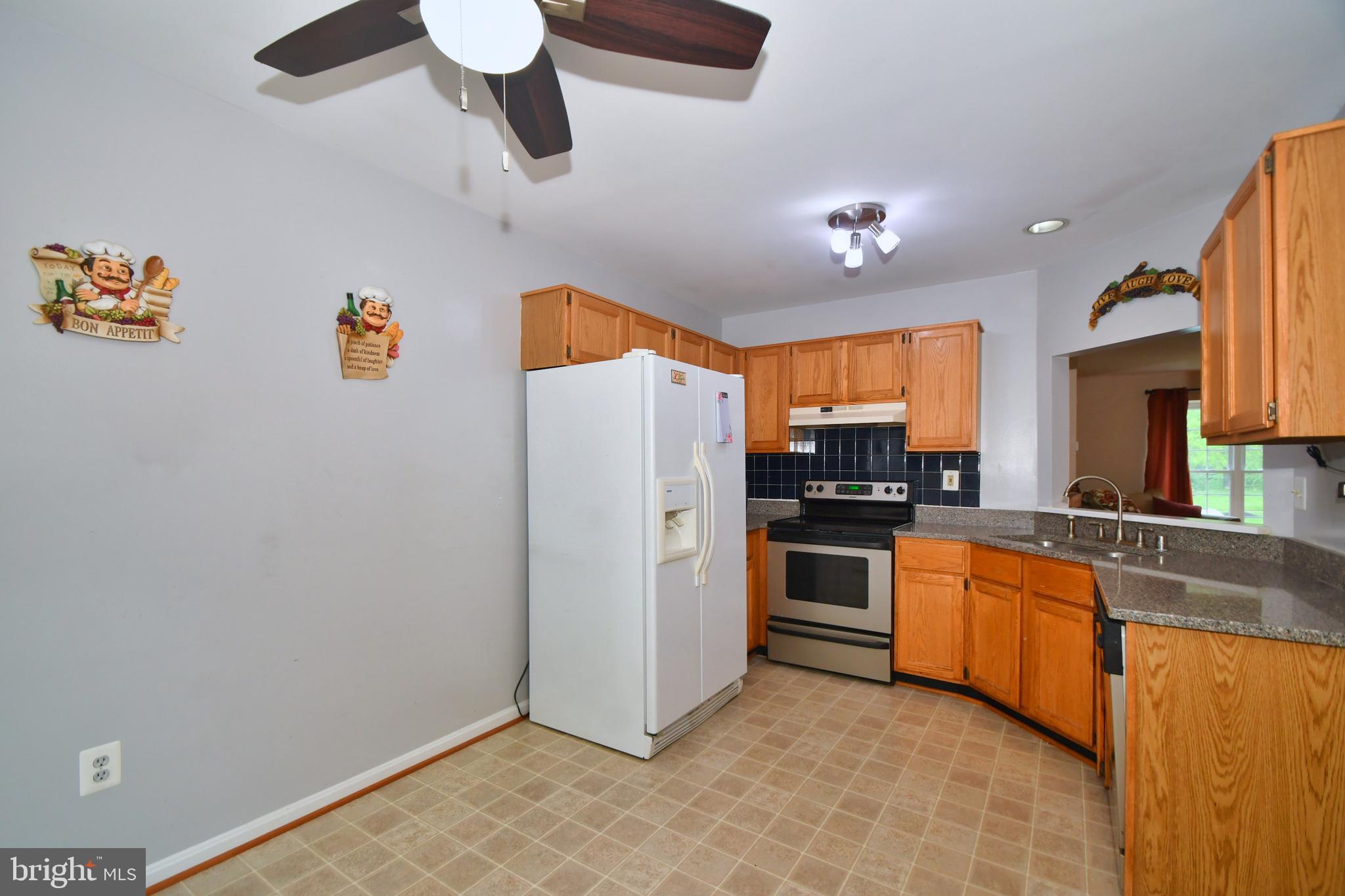 210 Gentlebrook Road Owings Mills, MD 21117 - Photo 14 of 40 Kitchen w/ Pass Through Opens Up to Family Room