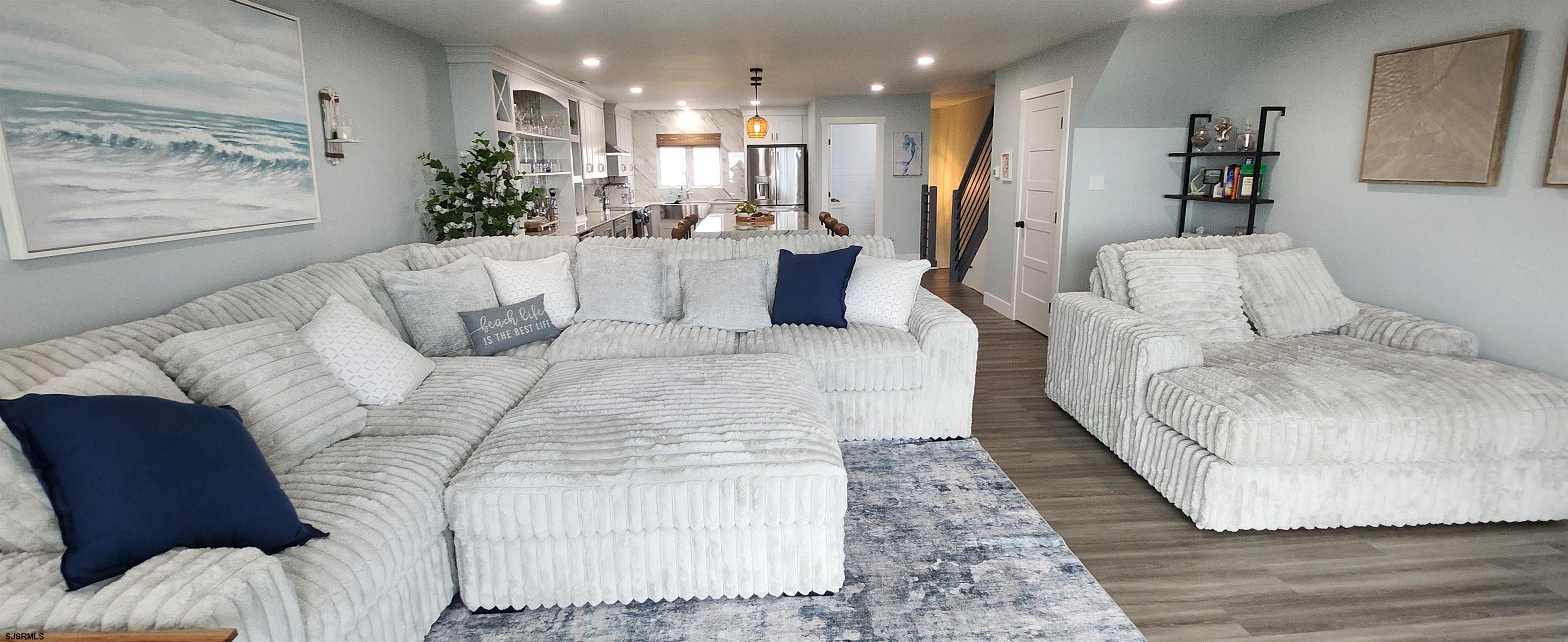 504 East Brigantine Avenue, Unit 504 Brigantine, NJ 08203 - Photo 19 of 43 a living room with furniture and a large mirror