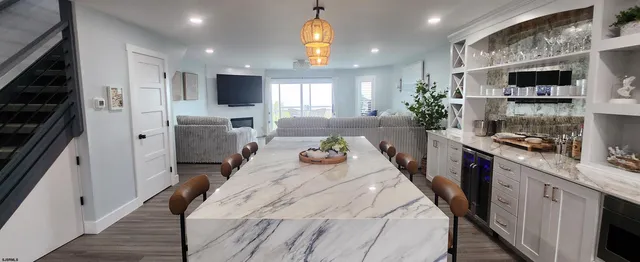 a large bedroom with a bed and a large mirror