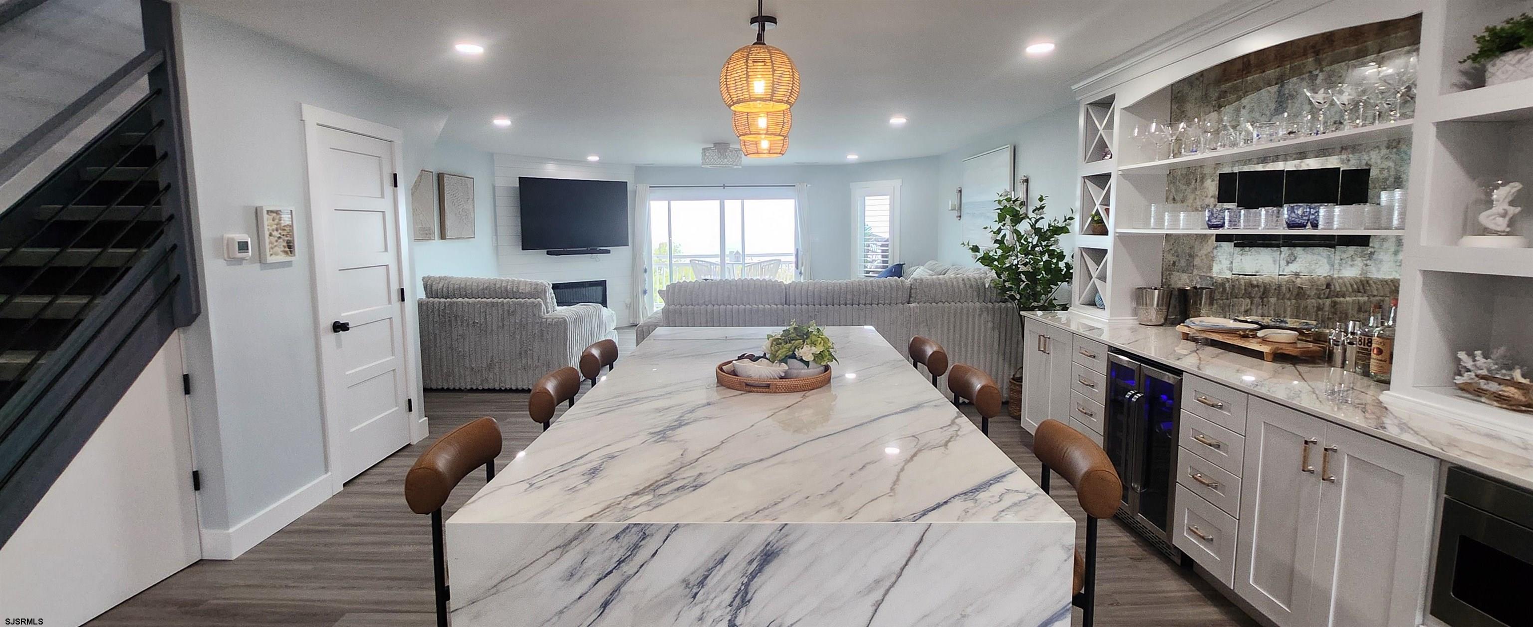 504 East Brigantine Avenue, Unit 504 Brigantine, NJ 08203 - Photo 20 of 43 a large kitchen with stainless steel appliances kitchen island granite countertop a sink and cabinets