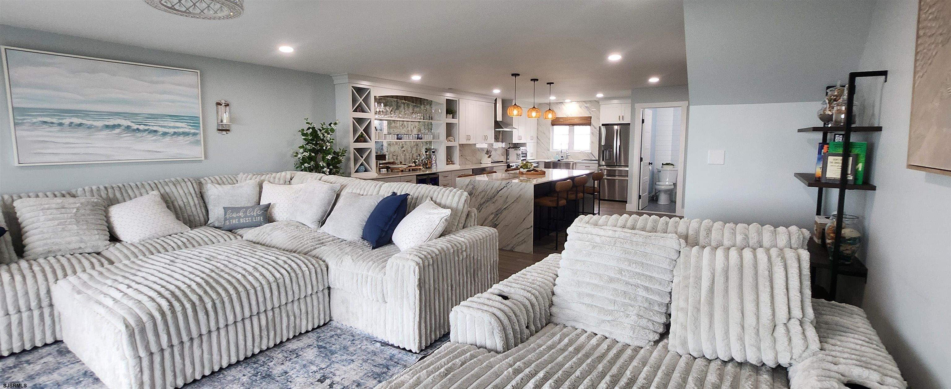 504 East Brigantine Avenue, Unit 504 Brigantine, NJ 08203 - Photo 21 of 43 a large bedroom with a bed and a large mirror