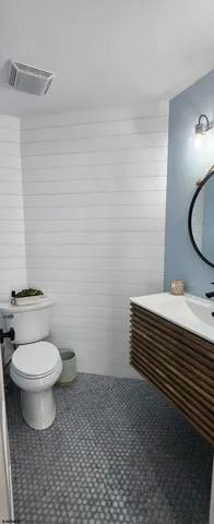 a bedroom with a bed and a view of bathroom