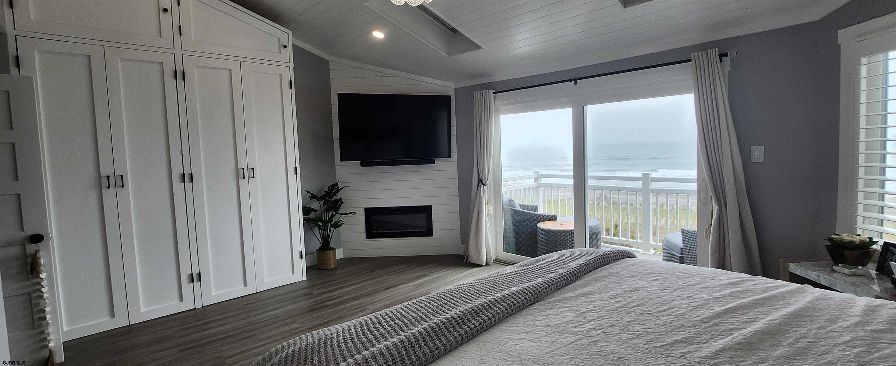 504 East Brigantine Avenue, Unit 504 Brigantine, NJ 08203 - Photo 29 of 43 a bedroom with a bed and a large window