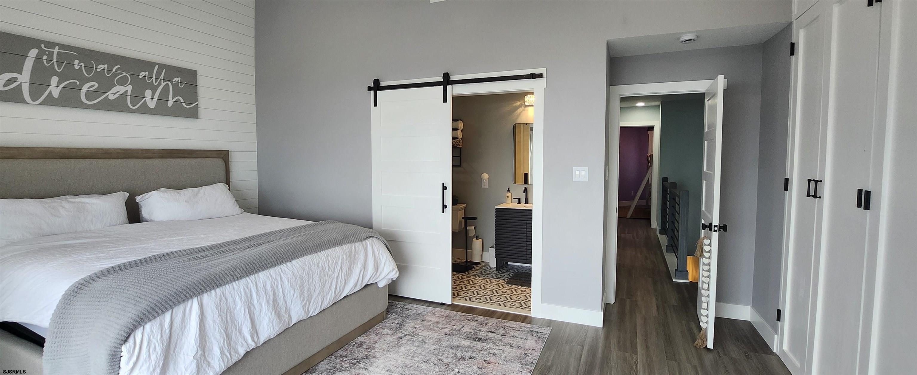 504 East Brigantine Avenue, Unit 504 Brigantine, NJ 08203 - Photo 30 of 43 a bedroom with bed and walk in closet