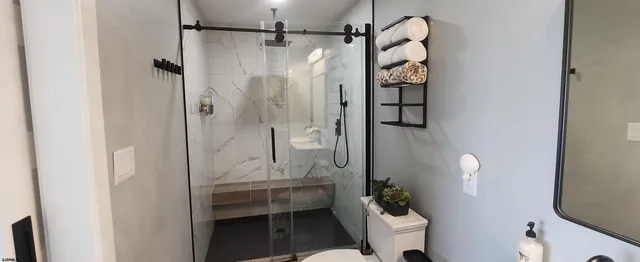 a room with a mirror and a sink