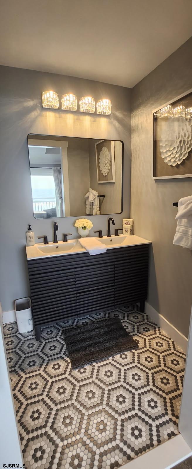 504 East Brigantine Avenue, Unit 504 Brigantine, NJ 08203 - Photo 33 of 43 a room with a mirror and a sink