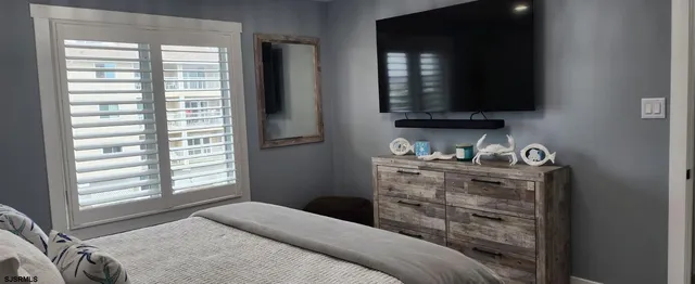 a bedroom with a bed and a table in it